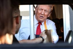 Donald Trump seen serving customers at a McDonald's drive-thru in Pennsylvania.