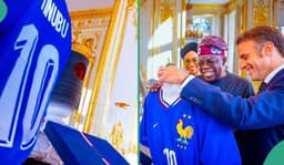 FRENCH PRESIDENT EMMANUEL MACRON PRESENTS CUSTOMIZED JERSEY TO NIGERIAN PRESIDENT BOLA TINUBU